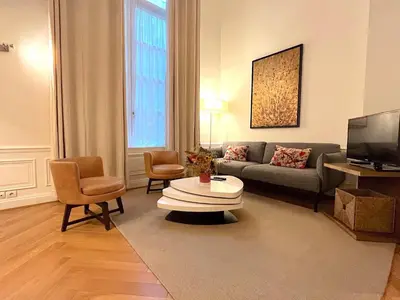Télévision ou salle de divertissement dans l'établissement L'appartement Pierre Charron C