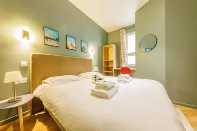 Un ou plusieurs lits dans un hébergement de l'établissement Charming Apartment - 1BR - Guy Moquet