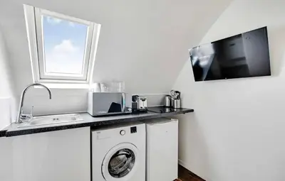 Cuisine ou kitchenette dans l'établissement Amsterdam 12 - Charmant studio à Saint-Lazare