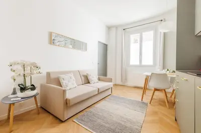 Coin salon dans l'établissement Appartement Moderne 1BR-4P - Guy Moquet