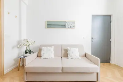 Coin salon dans l'établissement Appartement Moderne 1BR-4P - Guy Moquet