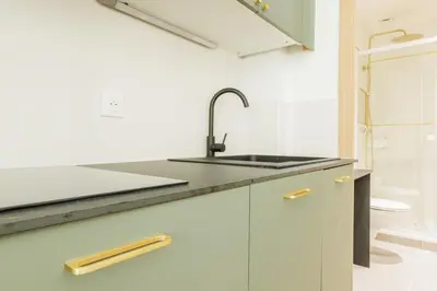 Cuisine ou kitchenette dans l'établissement Appartement Moderne 1BR-4P - Guy Moquet