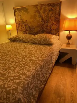 Un ou plusieurs lits dans un hébergement de l'établissement Superbe Duplex au Coeur de Montorgueil