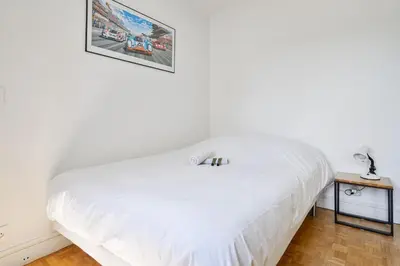 Un ou plusieurs lits dans un hébergement de l'établissement Appartement Garibaldi - Welkeys