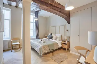 Un ou plusieurs lits dans un hébergement de l'établissement Apartment Center of Paris by Studio prestige
