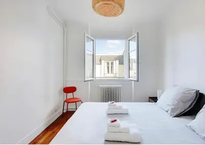 Un ou plusieurs lits dans un hébergement de l'établissement Appartement, cœur des Batignolles Montmartre