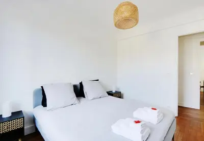Un ou plusieurs lits dans un hébergement de l'établissement Appartement, cœur des Batignolles Montmartre
