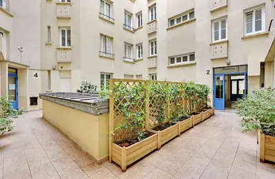 Jardin de l'établissement Appartement, cœur des Batignolles Montmartre
