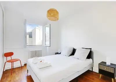Un ou plusieurs lits dans un hébergement de l'établissement Appartement, cœur des Batignolles Montmartre