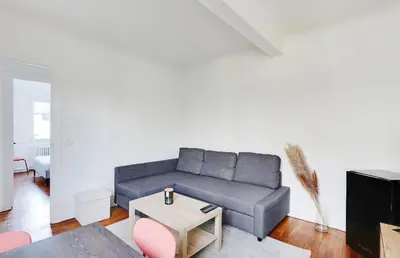 Coin salon dans l'établissement Appartement, cœur des Batignolles Montmartre