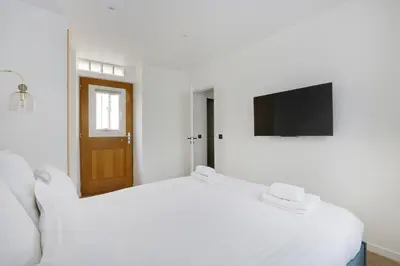 Un ou plusieurs lits dans un hébergement de l'établissement Pick A Flat's Apartment in Montorgueil - Rue Notre Dame de Recouvrance