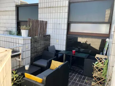 Coin salon dans l'établissement Nid de rêve, vue imprenable sur Paris et terrasse 10m2