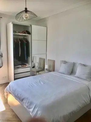 Un ou plusieurs lits dans un hébergement de l'établissement Bel appartement Montparnasse 70m2