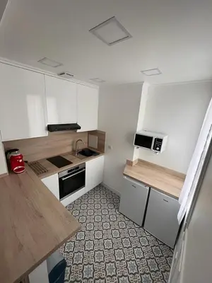 Cuisine ou kitchenette dans l'établissement Cosy appartement paris à deux pas