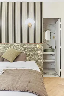 Un ou plusieurs lits dans un hébergement de l'établissement Apartment Champs Elysée bu Studio prestige