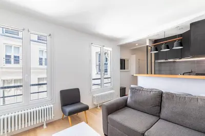 Coin salon dans l'établissement Stylish Paris Apartment near Louvre & Notre-Dame