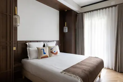 Un ou plusieurs lits dans un hébergement de l'établissement HIGHSTAY - Luxury Serviced Apartments - North Marais 2
