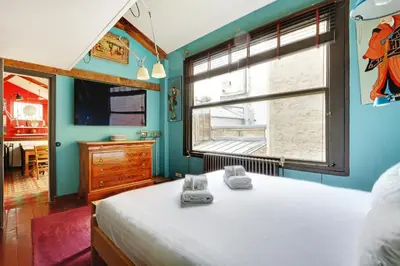 Un ou plusieurs lits dans un hébergement de l'établissement Pick A Flat's Townhouse in Montparnasse - Boulevard du Montparnasse