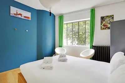 Un ou plusieurs lits dans un hébergement de l'établissement Pick A Flat's Townhouse in Montparnasse - Boulevard du Montparnasse