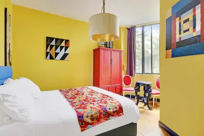 Un ou plusieurs lits dans un hébergement de l'établissement Pick A Flat's Townhouse in Montparnasse - Boulevard du Montparnasse
