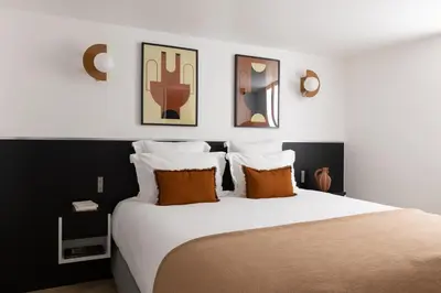 Un ou plusieurs lits dans un hébergement de l'établissement HIGHSTAY - Luxury Serviced Apartments - Saint-Honoré