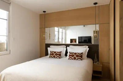 Un ou plusieurs lits dans un hébergement de l'établissement HIGHSTAY - Luxury Serviced Apartments - Saint-Honoré