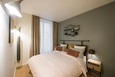 Un ou plusieurs lits dans un hébergement de l'établissement Magnifique appartement central 3 chambres / 3 BDR
