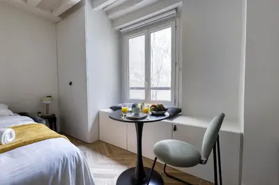 Un ou plusieurs lits dans un hébergement de l'établissement New and Designed Studio well Equipped - Heart of Paris 2