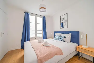 Un ou plusieurs lits dans un hébergement de l'établissement Appart 4pers#2 Bedrooms#Louvres#Palais Royal#Opéra