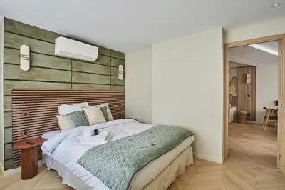 Un ou plusieurs lits dans un hébergement de l'établissement Résidence Luxembourg St Germain des Près by Studio prestige