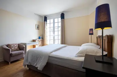 Un ou plusieurs lits dans un hébergement de l'établissement Lovely & Quiet à Montmartre