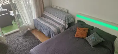 Coin salon dans l'établissement Chambre pour 4 chez Rihani près de la Tour Eiffel