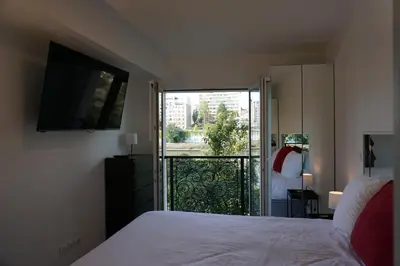 Un ou plusieurs lits dans un hébergement de l'établissement Résidences Grande Jatte, Face Seine, Suites Luxe 52m2 à 97m2, Hôpital Américain à 600m