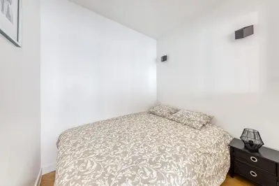 Un ou plusieurs lits dans un hébergement de l'établissement L'Appartement d'Art et de Lumière