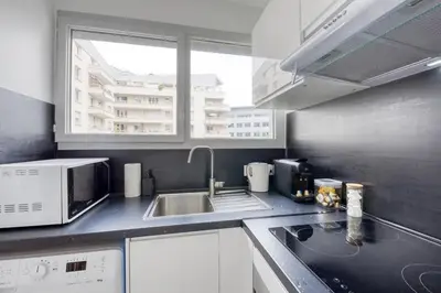 Cuisine ou kitchenette dans l'établissement L'Appartement d'Art et de Lumière