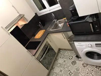 Cuisine ou kitchenette dans l'établissement Appartement 60 m², porte de Saint-Cloud