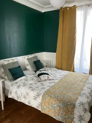 Un ou plusieurs lits dans un hébergement de l'établissement Cosy appartement in Paris