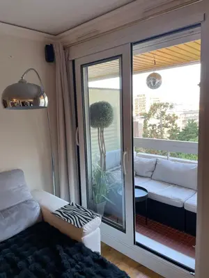 Coin salon dans l'établissement Appartement Belle Feuille