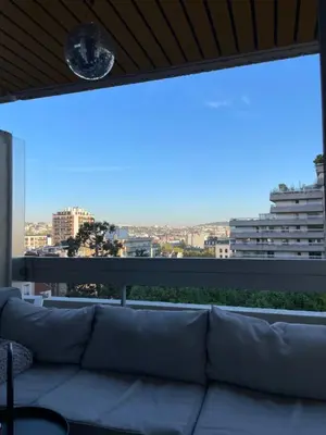 Coin salon dans l'établissement Appartement Belle Feuille