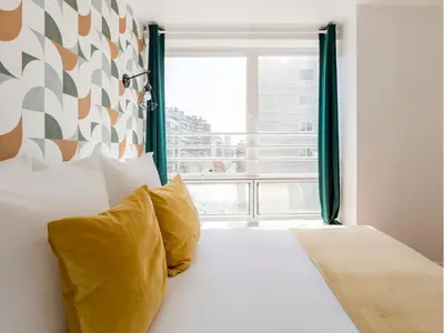 Un ou plusieurs lits dans un hébergement de l'établissement Merveil - Family Suite - Tour Eiffel - Finlay