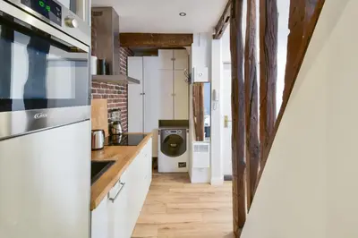 Cuisine ou kitchenette dans l'établissement Studio Rostène - Welkeys