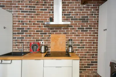 Cuisine ou kitchenette dans l'établissement Studio Rostène - Welkeys