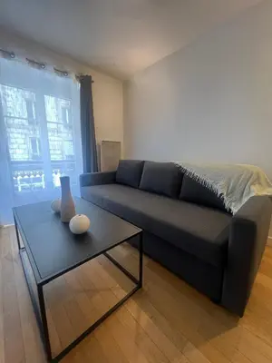 Coin salon dans l'établissement Your cosy Sacré-Coeur Apartment !