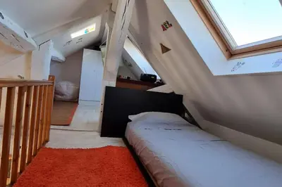 Un ou plusieurs lits dans un hébergement de l'établissement Superbe logement au centre de Paris
