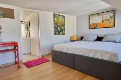 Un ou plusieurs lits dans un hébergement de l'établissement Superbe logement au centre de Paris