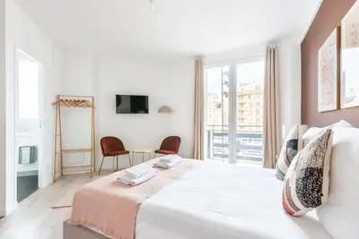 Un ou plusieurs lits dans un hébergement de l'établissement Studio lumineux Paris Est - Serurier