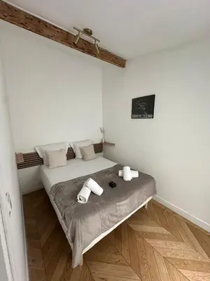 Un ou plusieurs lits dans un hébergement de l'établissement 265 Suite Antoine - Superbe Appartement à Paris