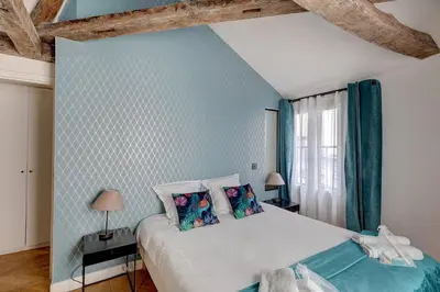 Un ou plusieurs lits dans un hébergement de l'établissement 265 Suite Antoine - Superbe Appartement à Paris