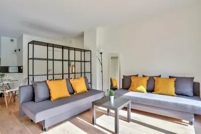 Coin salon dans l'établissement Studio - Appartement Quartier Montparnasse 2 Free Netflix