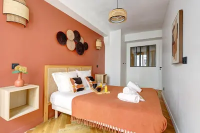 Un ou plusieurs lits dans un hébergement de l'établissement 266 Suite Montefiore Superbe Appartement à Paris
